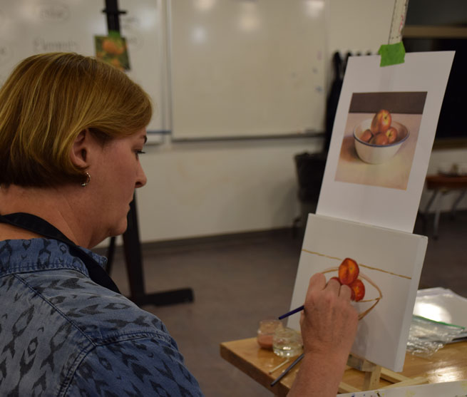 woman painting still life